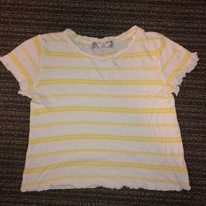 Yellow and white striped shirt sleeve shirt.